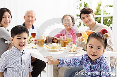 Asian family having dinnerÂ at home Stock Photo